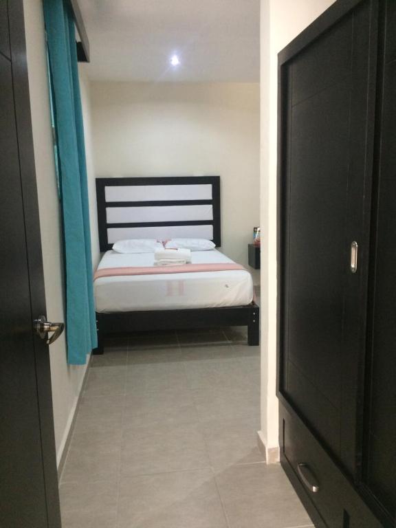 Postel nebo postele na pokoji v ubytování Hotel Sevilla Palenque