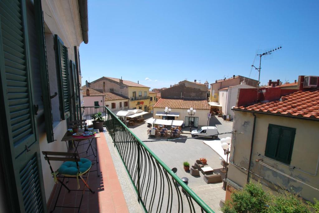 an apartment balcony with a view of a courtyard at Casa Lidia in Capoliveri