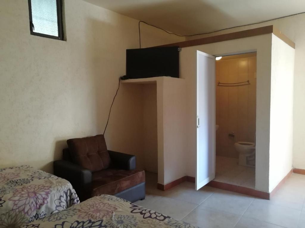 TV a/nebo společenská místnost v ubytování Hotel Cuauhtemoc