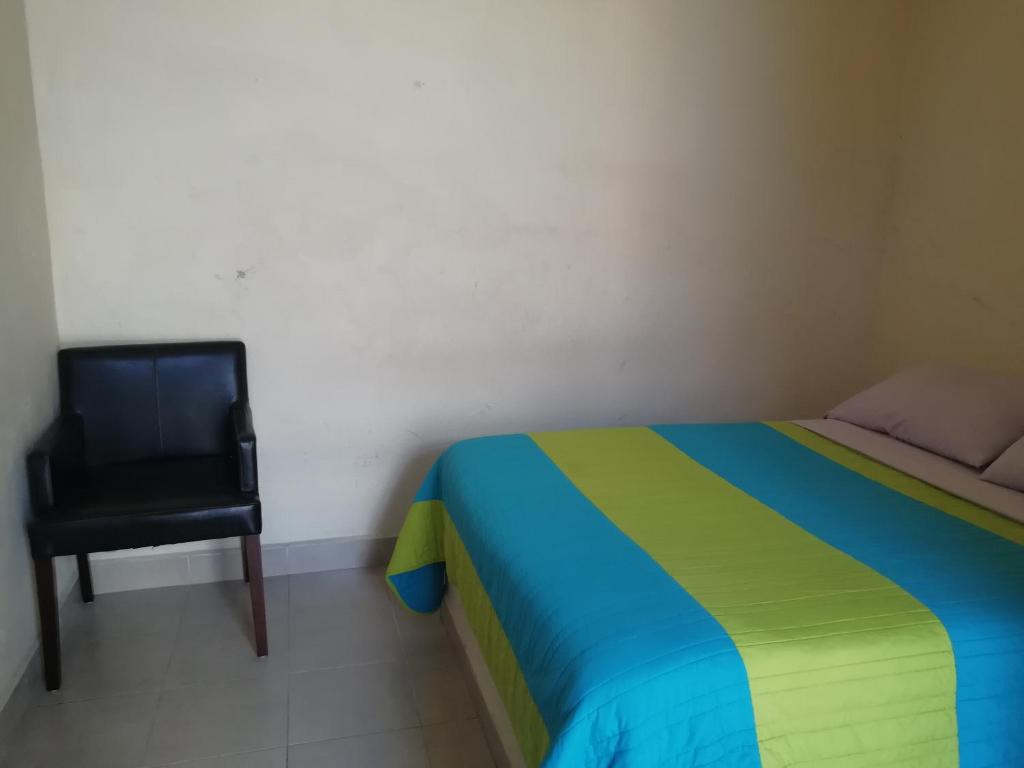 Postel nebo postele na pokoji v ubytování Hotel Cuauhtemoc