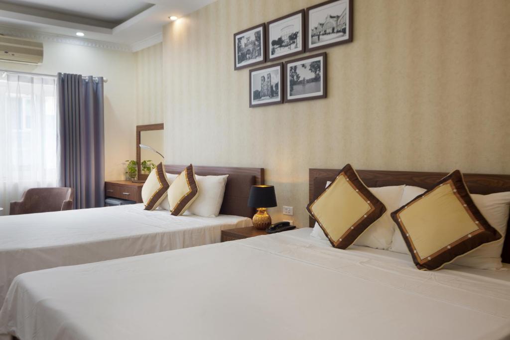 Postel nebo postele na pokoji v ubytování Spoon Hotel