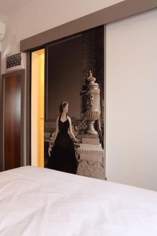Postel nebo postele na pokoji v ubytování Hotel Doriguzzi