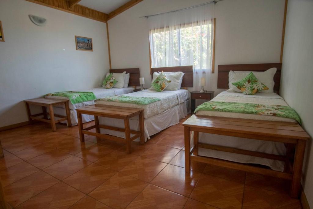 Cama o camas de una habitación en Cabañas Henua Iti