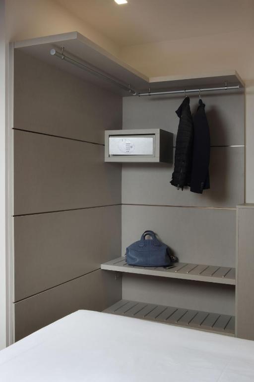 Postel nebo postele na pokoji v ubytování Hotel Doriguzzi