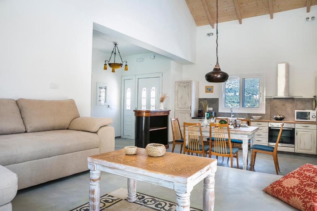 a living room with a couch and a table at Villa Pilali in Kefallonia