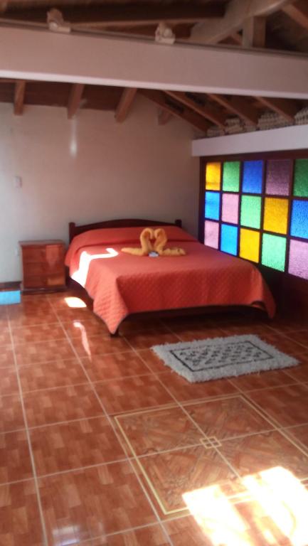 Postel nebo postele na pokoji v ubytování Chez Alicia Hostal