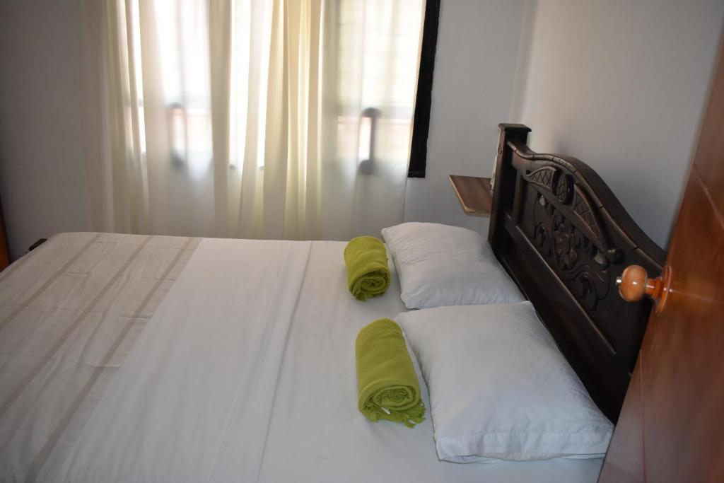 Voodi või voodid majutusasutuse Hostal Palohe Taganga toas