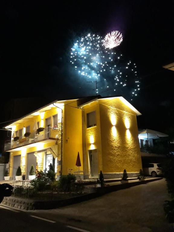 a building with fireworks on top of it at night at Bed and Breakfast lo Scrigno in Polinago