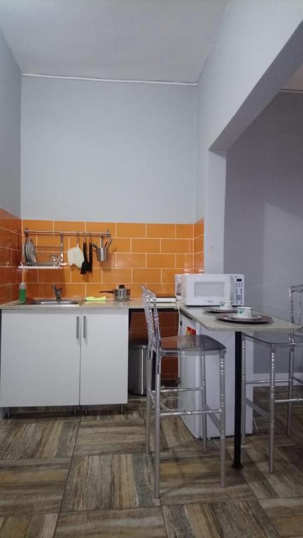 Kuchyň nebo kuchyňský kout v ubytování Tavalero Rooms