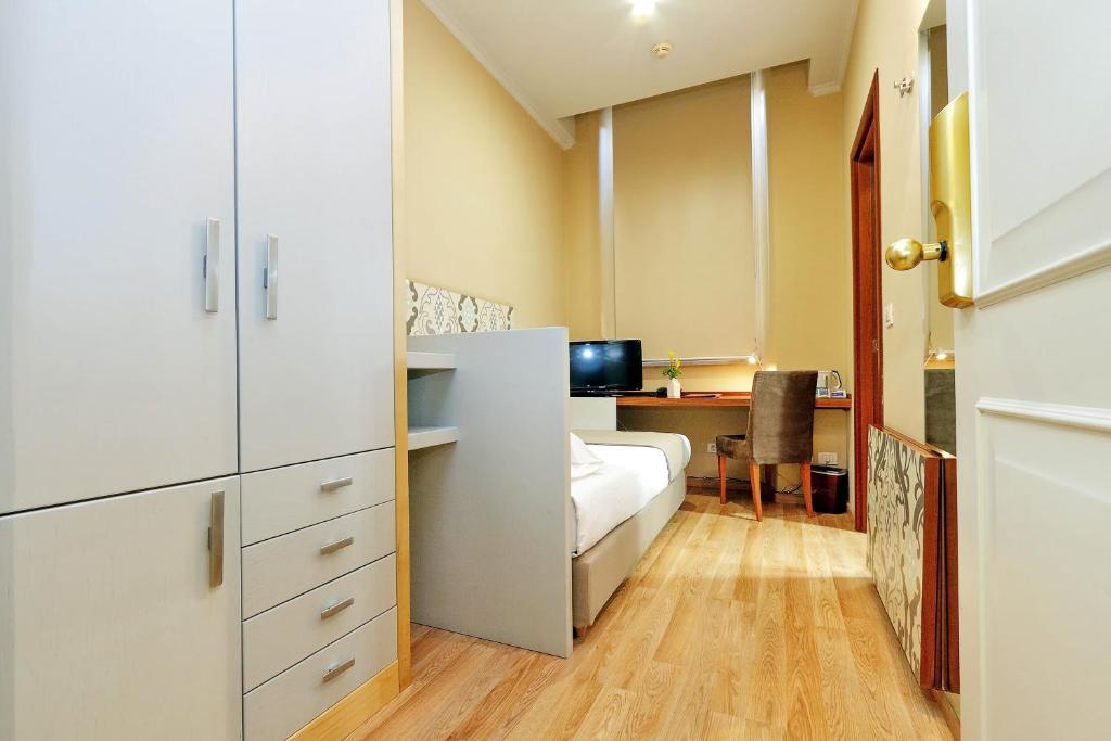Postel nebo postele na pokoji v ubytování Hotel Camelia