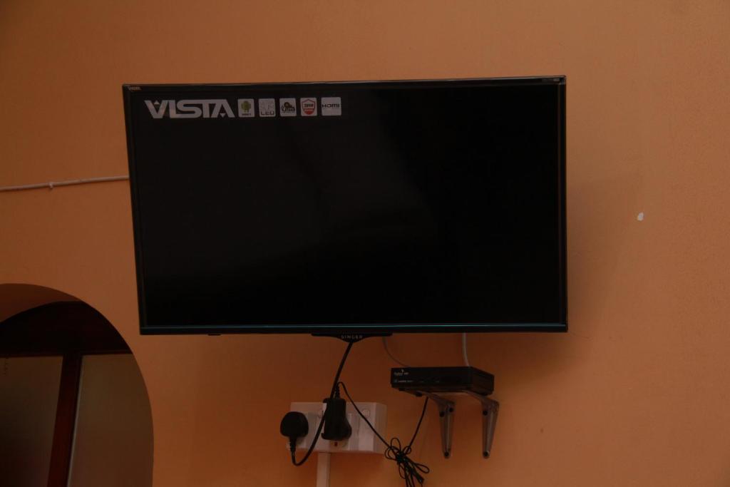 TV a/nebo společenská místnost v ubytování Anura Guest Inn
