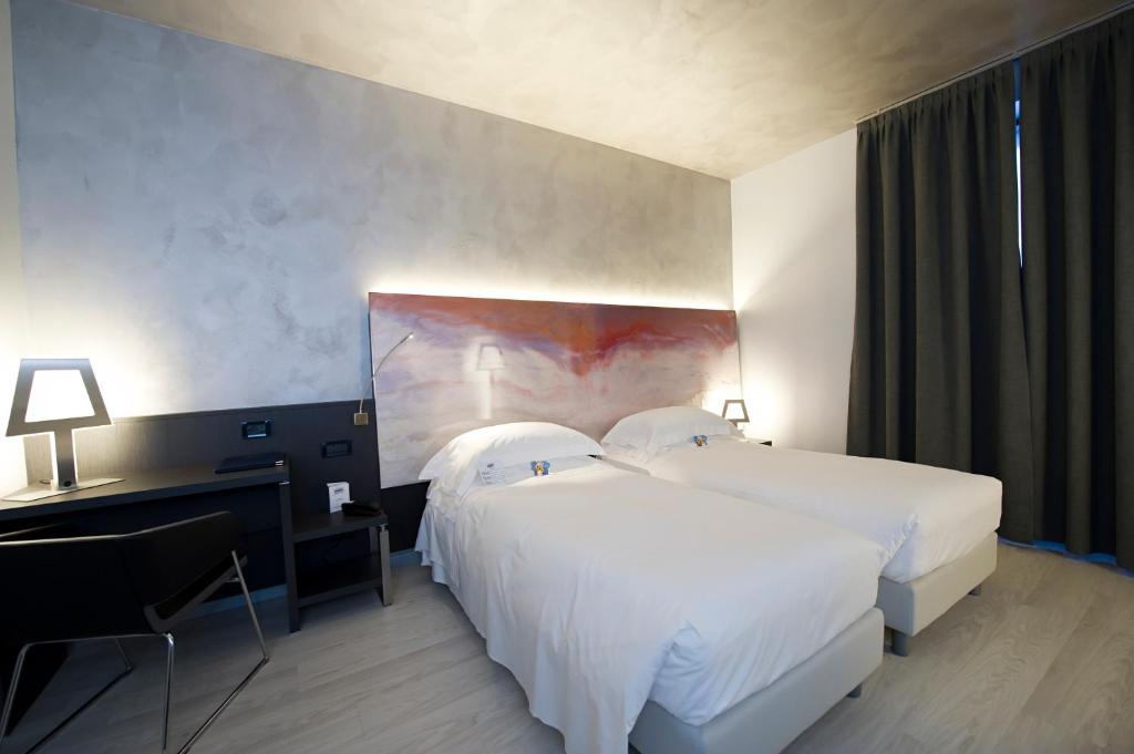 Postel nebo postele na pokoji v ubytování Arli Hotel Business and Wellness