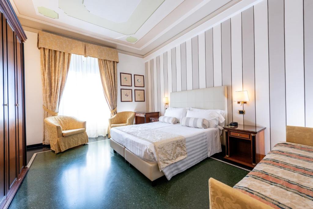 Postel nebo postele na pokoji v ubytování Hotel Jolanda
