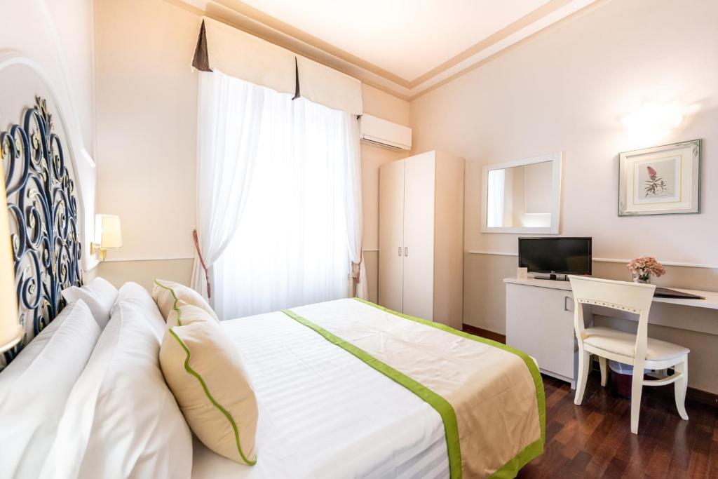 Postel nebo postele na pokoji v ubytování Hotel Jolanda
