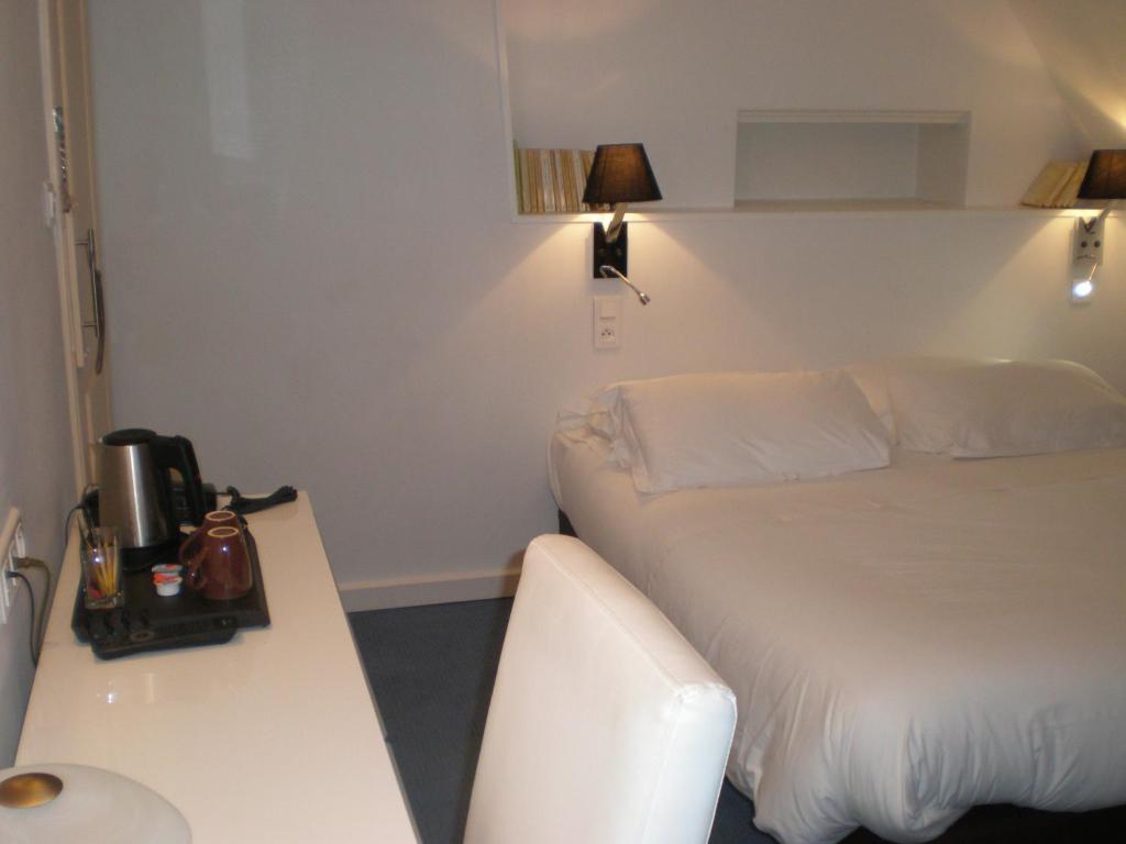 Postel nebo postele na pokoji v ubytování Best Western Hôtel Montgomery
