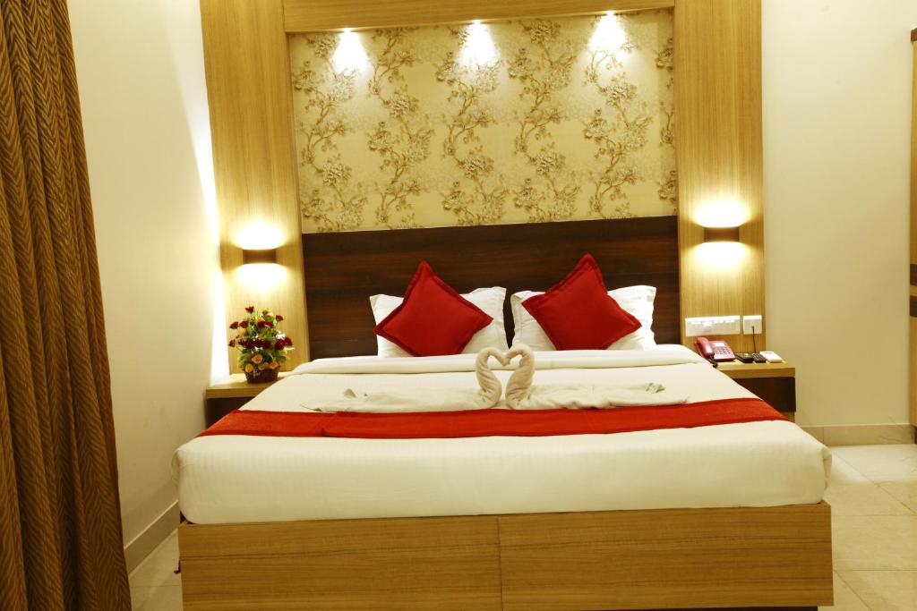 Postel nebo postele na pokoji v ubytování Prayana Hotels