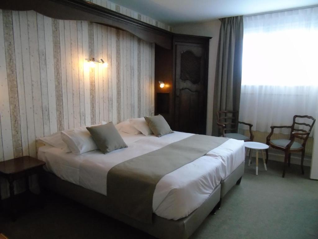 Postel nebo postele na pokoji v ubytování Best Western Hôtel Montgomery