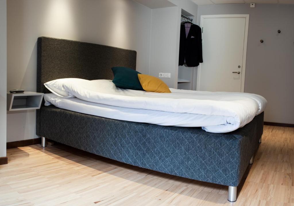 Postel nebo postele na pokoji v ubytování Moment Hotels