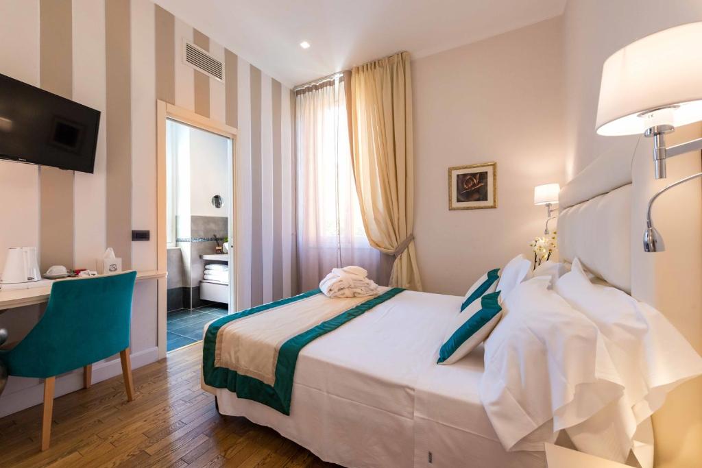 Postel nebo postele na pokoji v ubytování Hotel Sant'Andrea