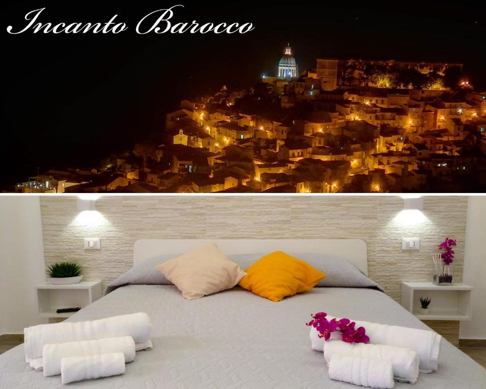 1 cama con 2 almohadas y vistas a la ciudad en Incanto barocco en Ragusa