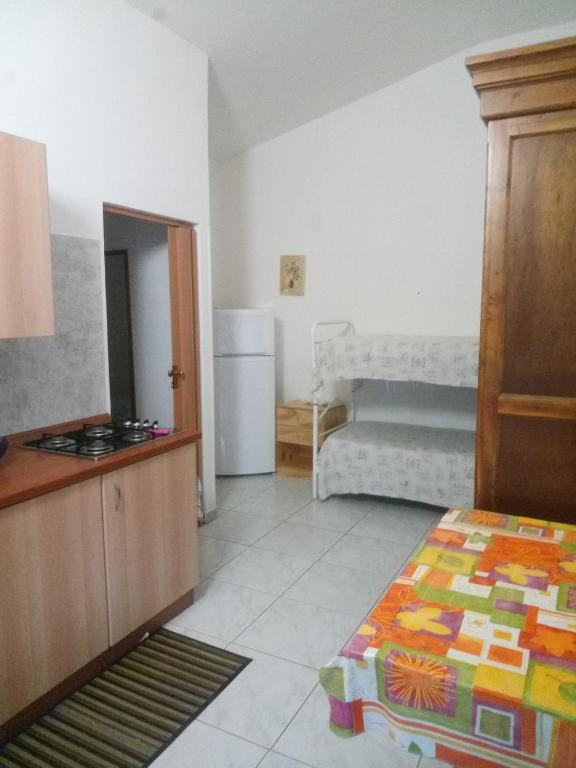 Postel nebo postele na pokoji v ubytování Appartamenti Frassanito