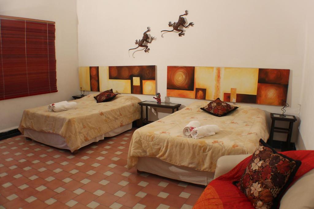 Postel nebo postele na pokoji v ubytování Casa Madero Rooms