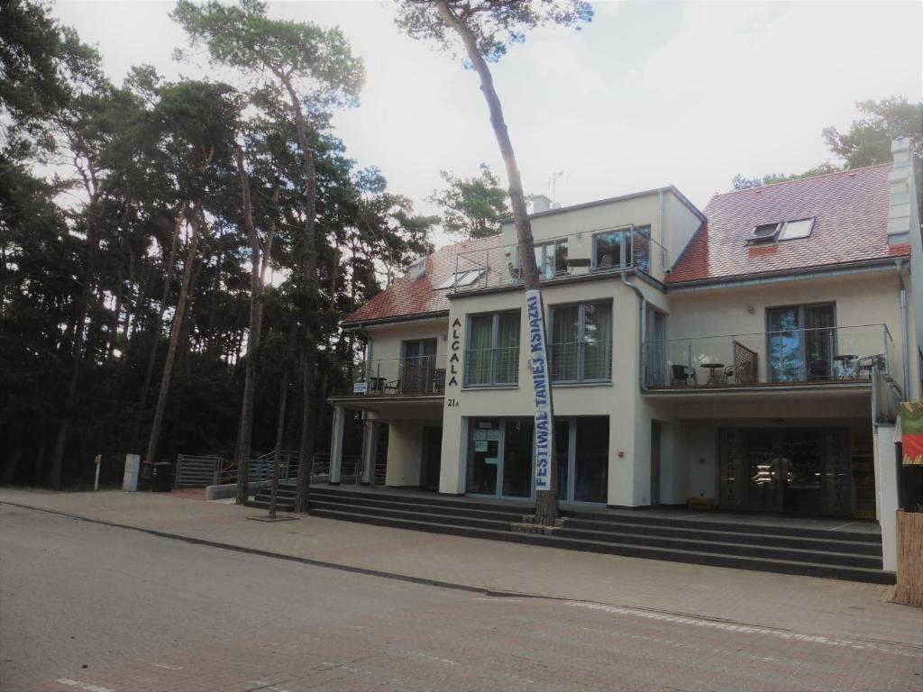 a building on the side of a street at Willa Alcala in Pobierowo