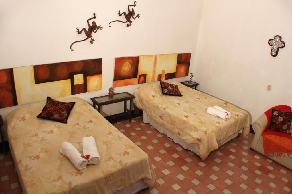 Postel nebo postele na pokoji v ubytování Casa Madero Rooms