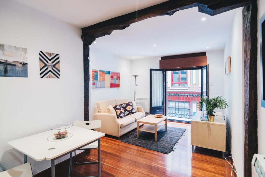 a living room with a couch and a table at Old Town Madari by People Rentals in Bilbao