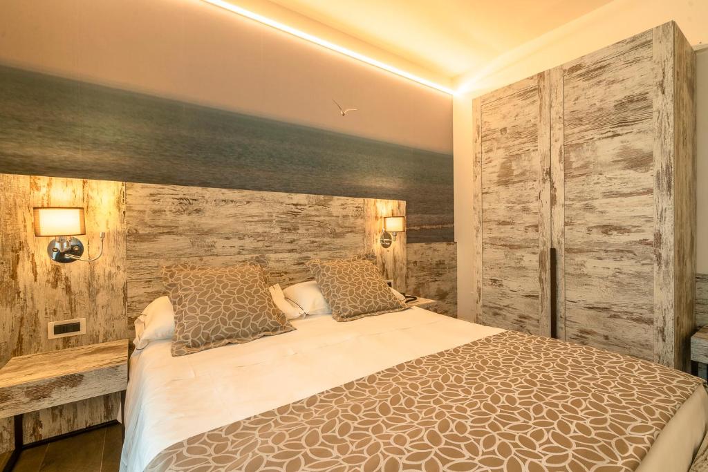 Postel nebo postele na pokoji v ubytování Hotel Ambassador