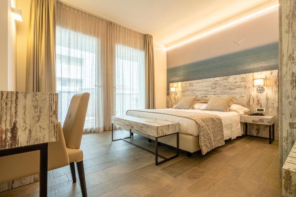 Postel nebo postele na pokoji v ubytování Hotel Ambassador