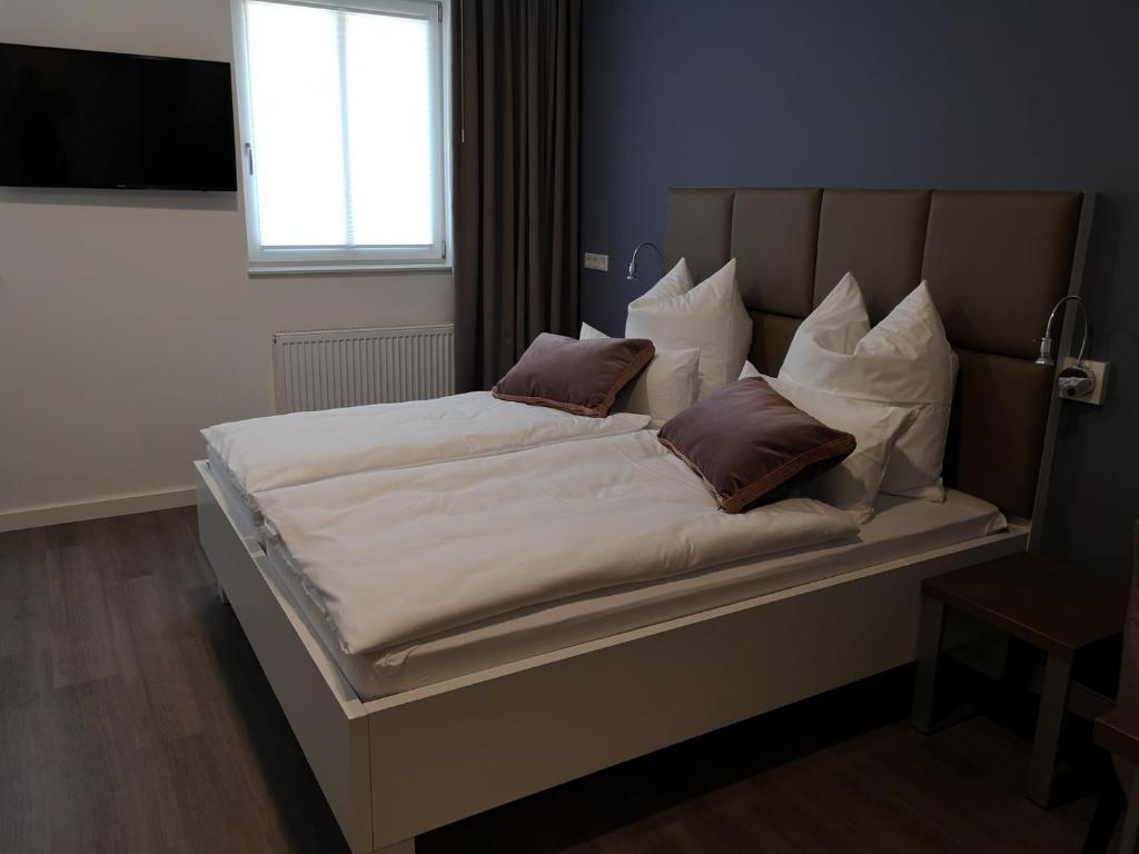 Postel nebo postele na pokoji v ubytování Trip Inn PostApart Aschaffenburg