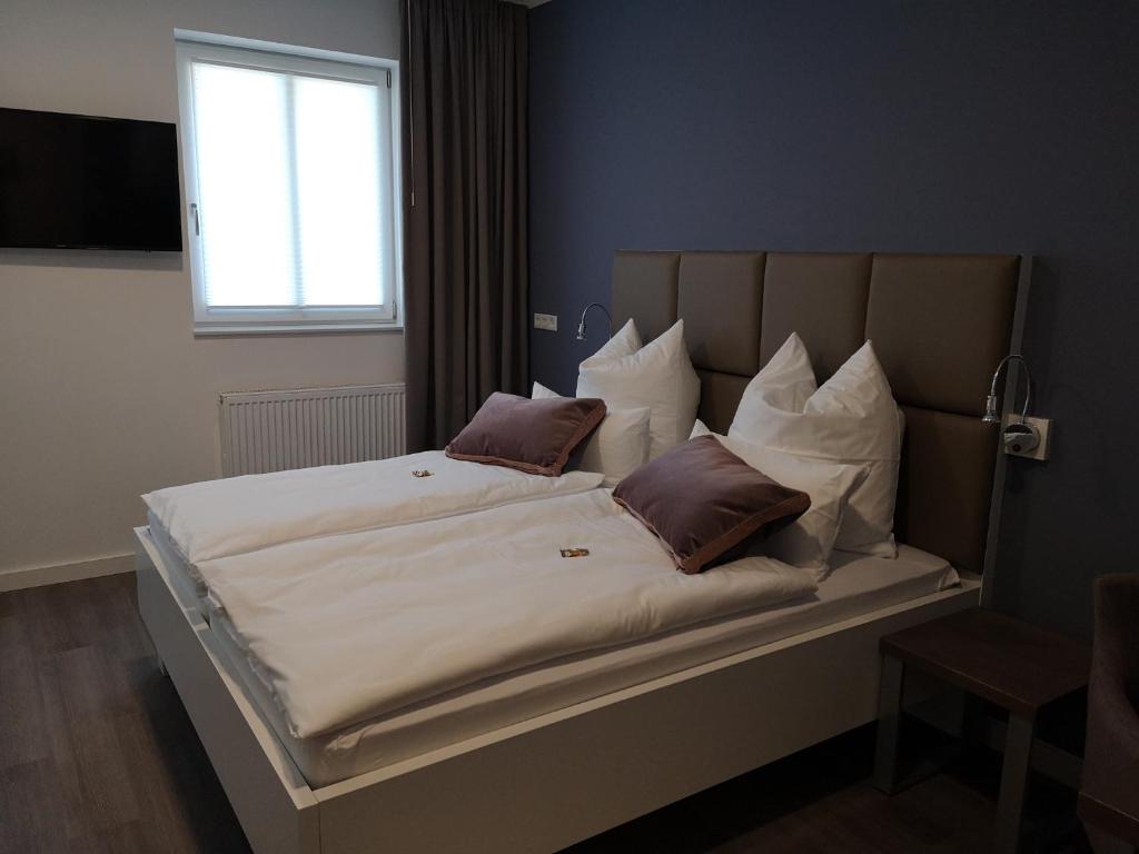Postel nebo postele na pokoji v ubytování Trip Inn PostApart Aschaffenburg