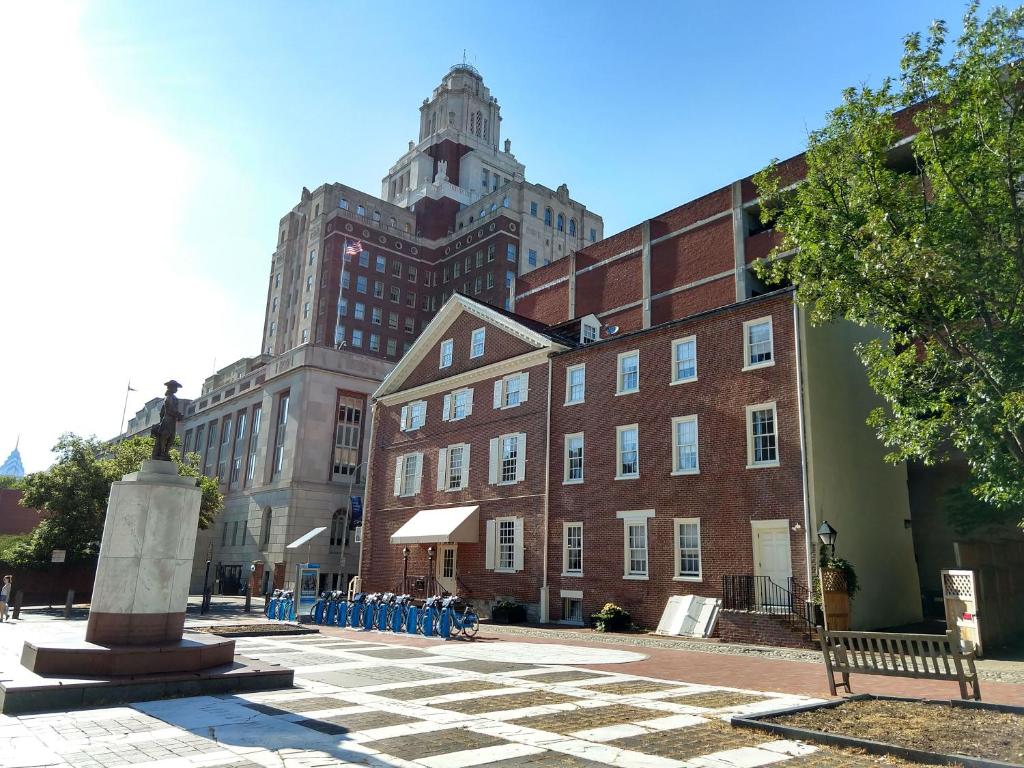 
a large brick building with a clock tower at Thomas Bond House in Philadelphia
