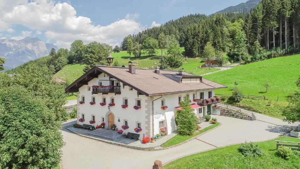 an aerial view of a house on a hill at Oberdeutinghof in Saalfelden am Steinernen Meer