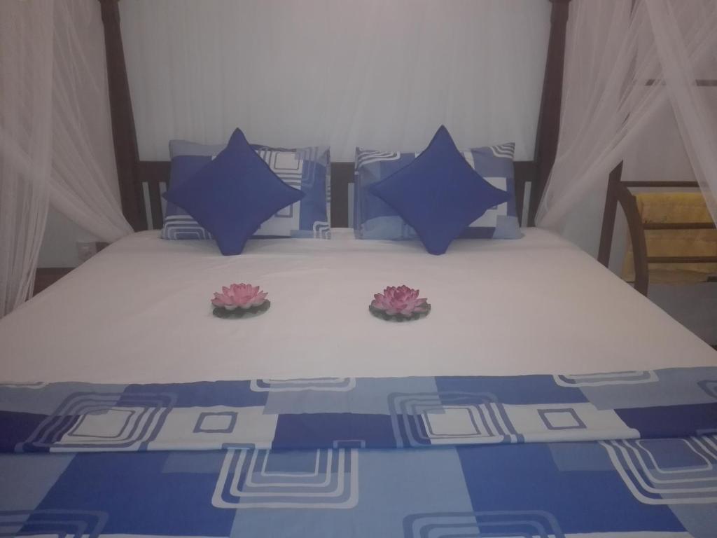 Postel nebo postele na pokoji v ubytování Neo Grand Villa