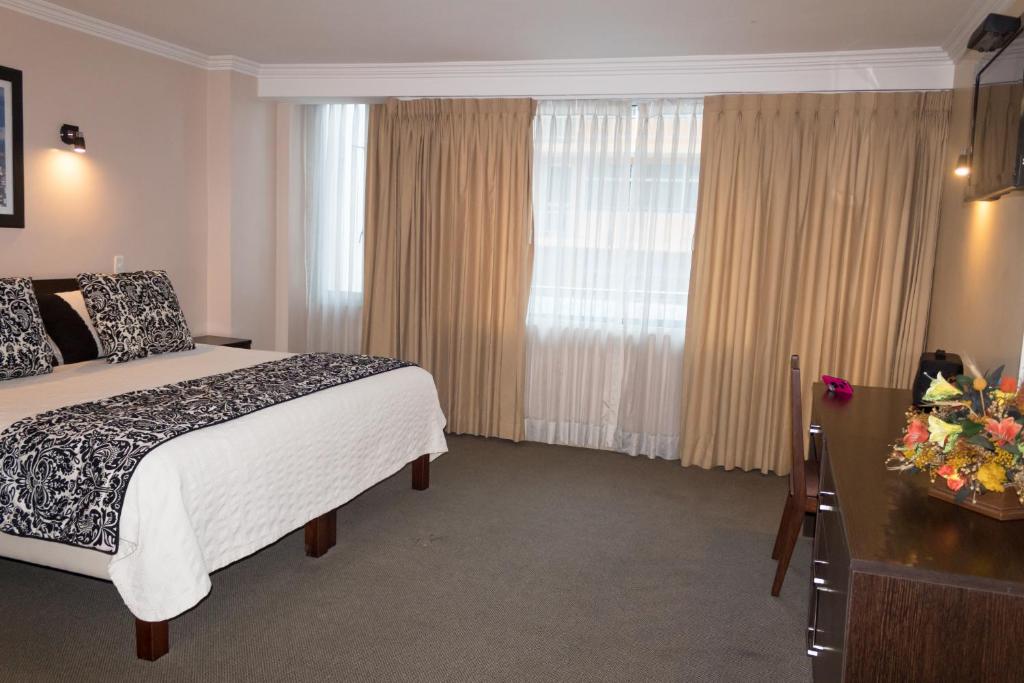 Postel nebo postele na pokoji v ubytování Hotel Novalux