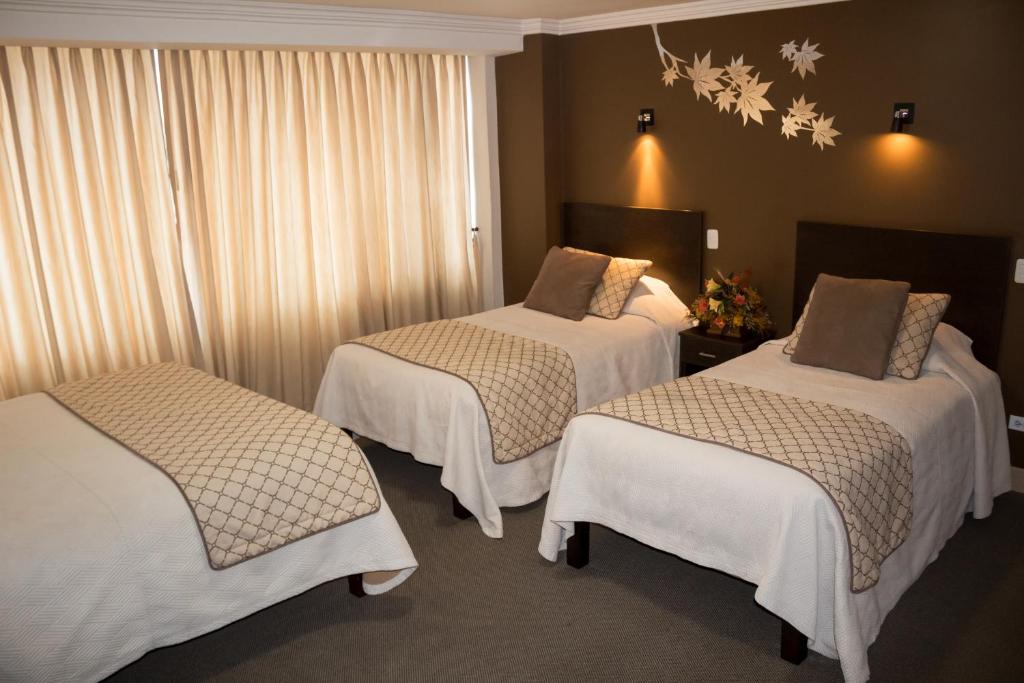 Postel nebo postele na pokoji v ubytování Hotel Novalux