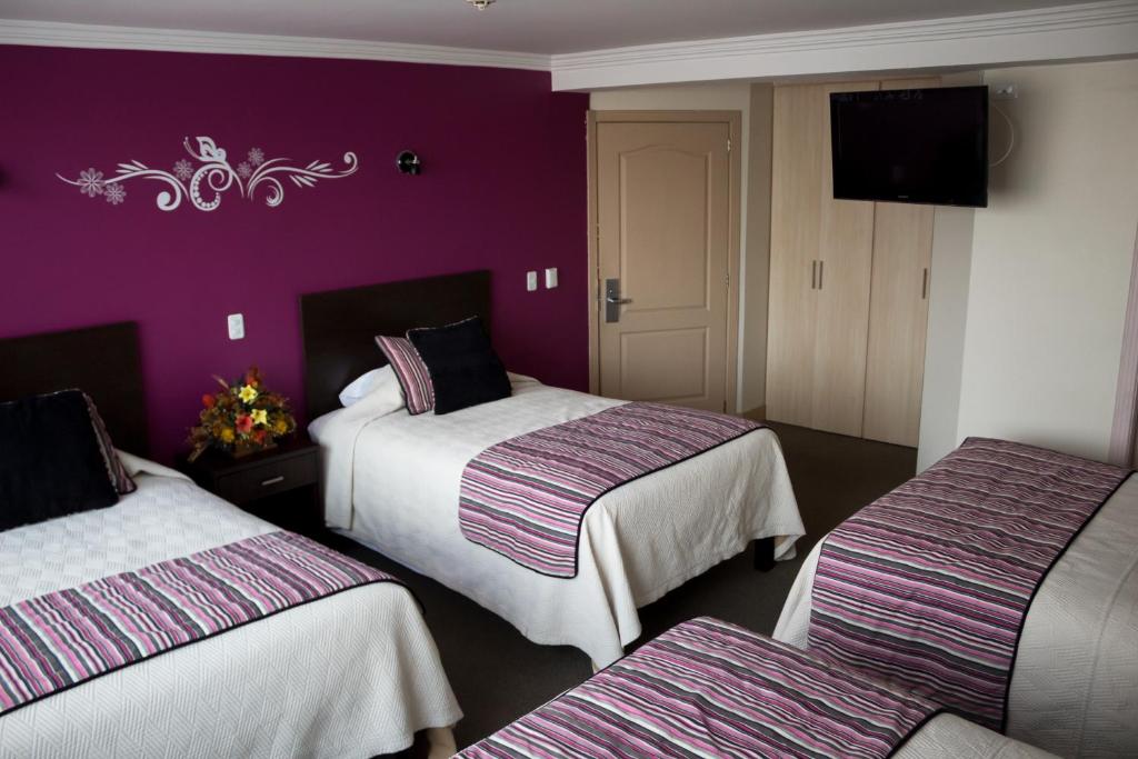 Postel nebo postele na pokoji v ubytování Hotel Novalux