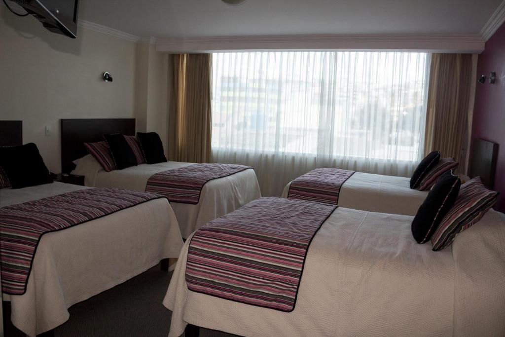 Postel nebo postele na pokoji v ubytování Hotel Novalux