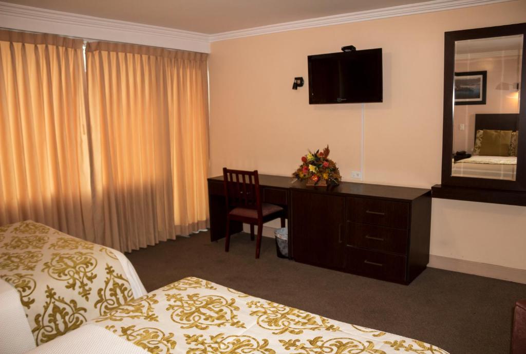 Postel nebo postele na pokoji v ubytování Hotel Novalux