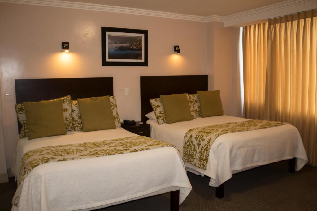 Postel nebo postele na pokoji v ubytování Hotel Novalux
