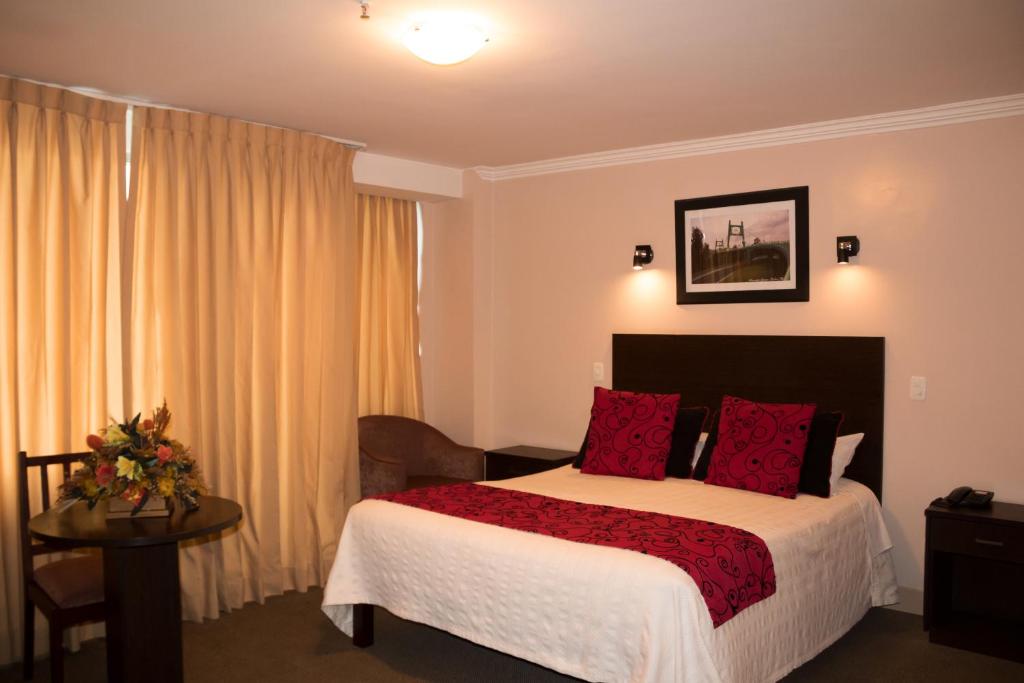 Postel nebo postele na pokoji v ubytování Hotel Novalux