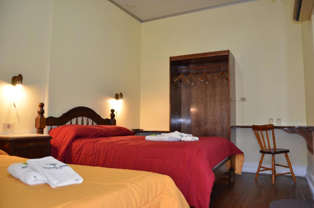 Un ou plusieurs lits dans un hébergement de l'établissement Hotel Romi