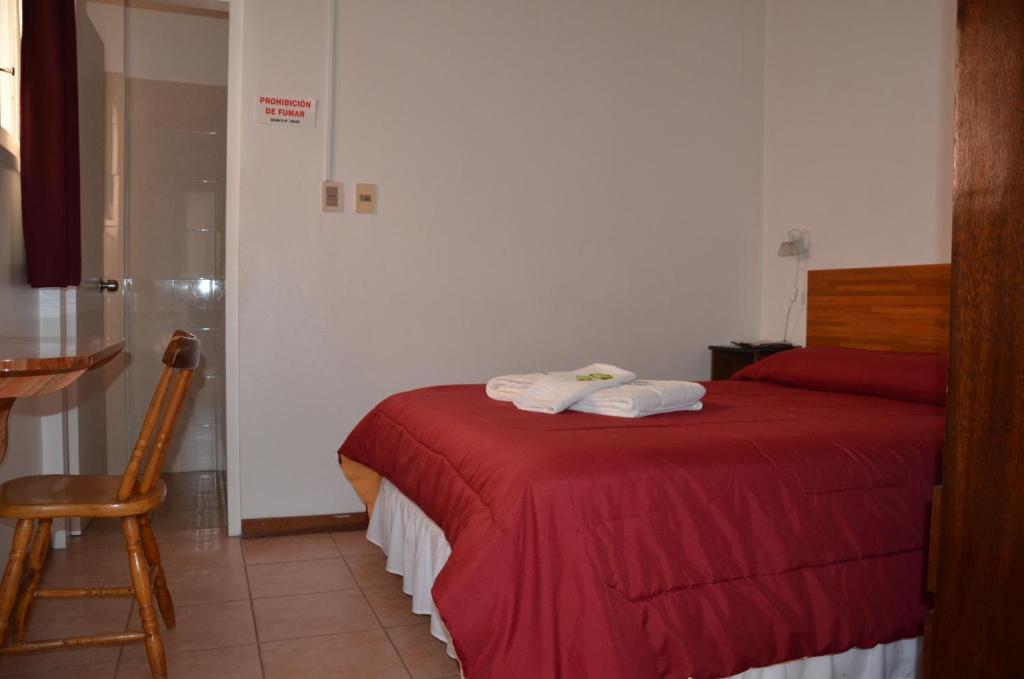 Un ou plusieurs lits dans un hébergement de l'établissement Hotel Romi
