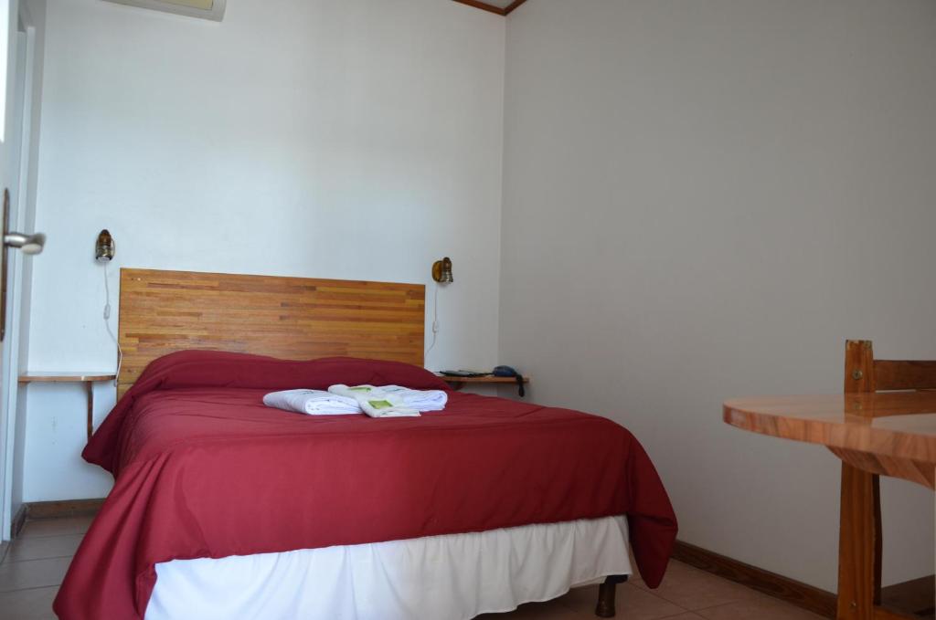 Un ou plusieurs lits dans un hébergement de l'établissement Hotel Romi