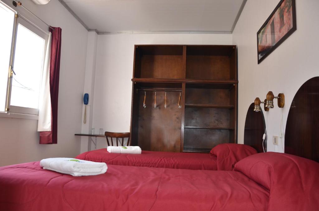 Un ou plusieurs lits dans un hébergement de l'établissement Hotel Romi