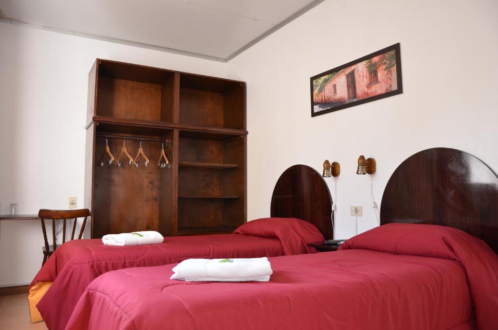 Un ou plusieurs lits dans un hébergement de l'établissement Hotel Romi