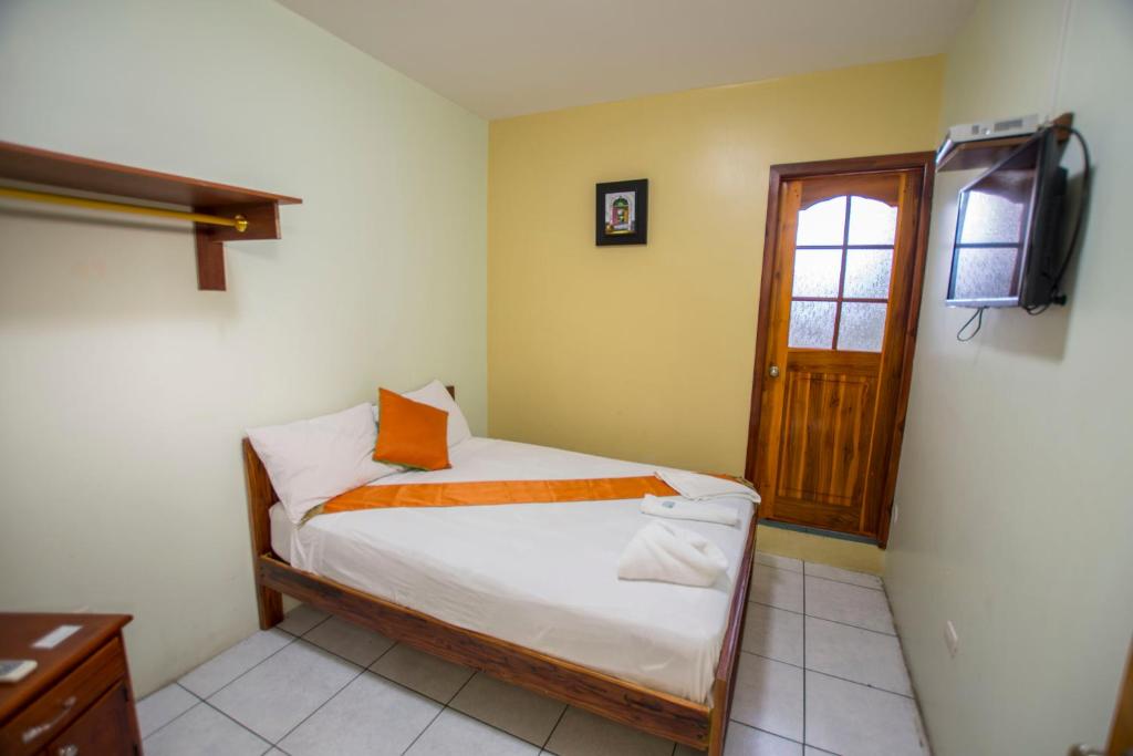 Postel nebo postele na pokoji v ubytování Hostal Andry