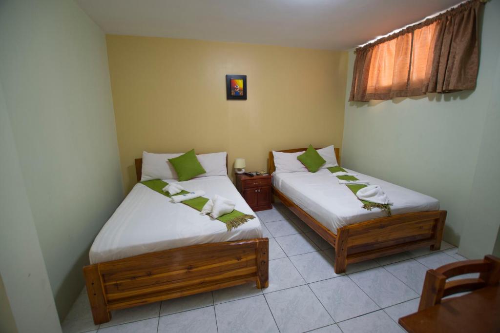 Postel nebo postele na pokoji v ubytování Hostal Andry